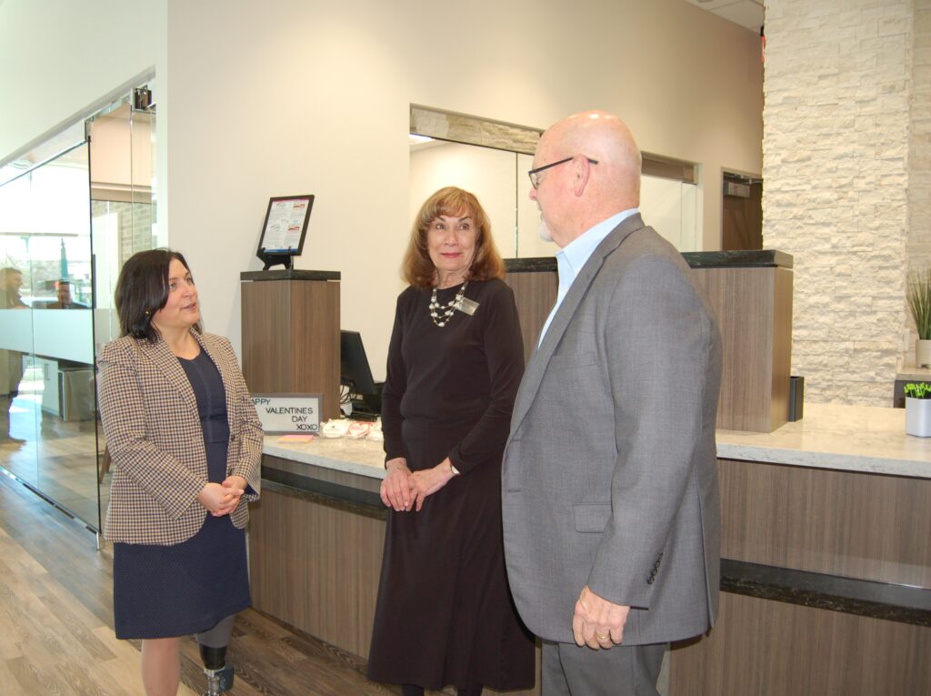 Pictured at the soft opening of the newly re-built Woodforest National Bank building in Downtown Conroe are bank representatives Jay Dreibelbis, President and CEO; Linda O’Dell, Conroe Downtown Branch Manager; and Patricia Brown, President of Conroe. (Photo by Liz Grimm)